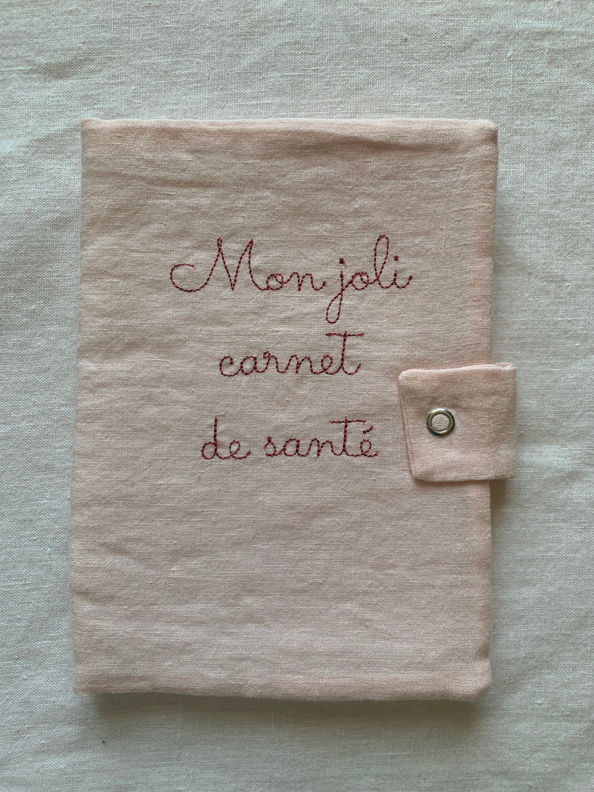 Protège carnet de santé lin rose pâle broderie rose "mon joli carnet de santé"
